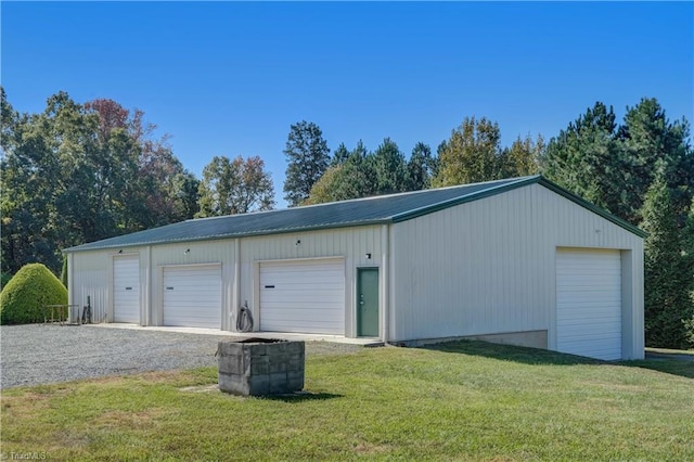 garage featuring a yard