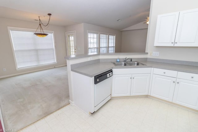 2221314 Delaney Dr, Burlington, NC 27215 - kitchen with white dishwasher, a sink, a peninsula, white cabinetry, and vaulted ceiling