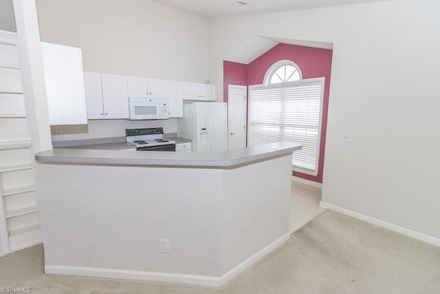 2221314 Delaney Dr, Burlington, NC 27215 - kitchen with white appliances, light carpet, vaulted ceiling, white cabinetry, and a peninsula