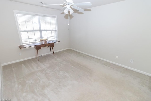 2221314 Delaney Dr, Burlington, NC 27215 - unfurnished room featuring ceiling fan, light colored carpet, baseboards, and an office area