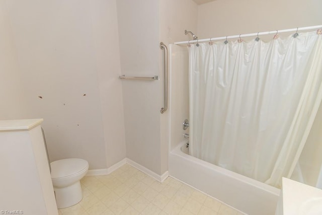 2221314 Delaney Dr, Burlington, NC 27215 - bathroom with toilet, shower / bath combo, baseboards, and tile patterned floors