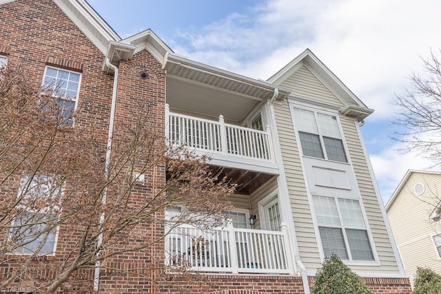 2221314 Delaney Dr, Burlington, NC 27215 - view of home's exterior with a balcony and brick siding