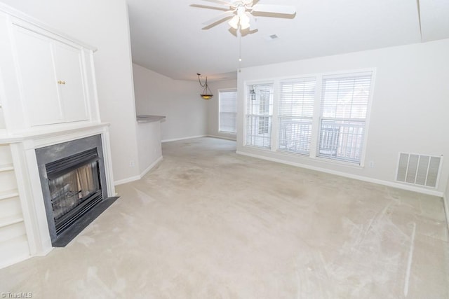 2221314 Delaney Dr, Burlington, NC 27215 - unfurnished living room with a fireplace, ceiling fan, light colored carpet, baseboards, and lofted ceiling