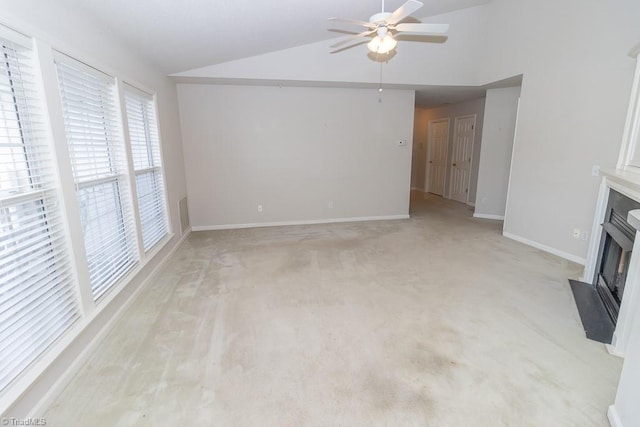 2221314 Delaney Dr, Burlington, NC 27215 - unfurnished living room with lofted ceiling, a ceiling fan, light colored carpet, a fireplace with flush hearth, and baseboards