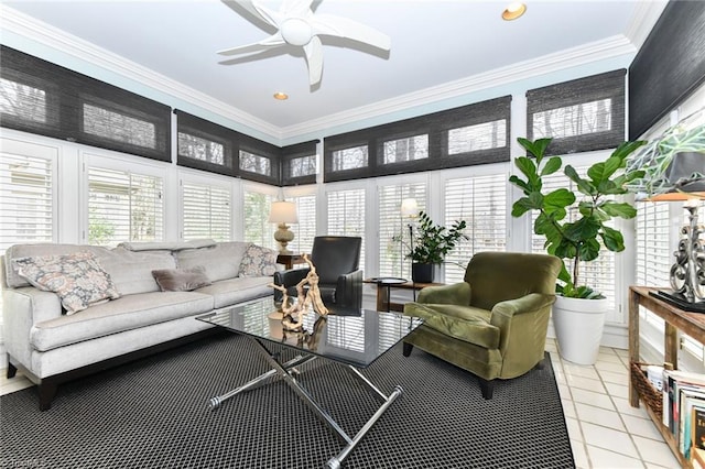 living area with crown molding, light tile patterned floors, and ceiling fan