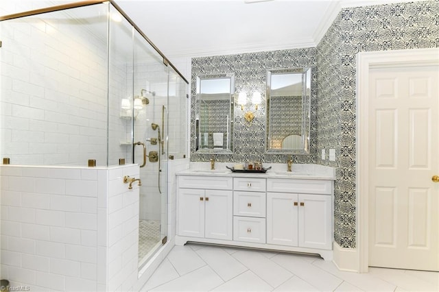 full bathroom with ornamental molding, a stall shower, and a sink