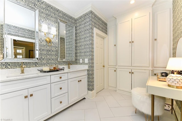 full bath featuring wallpapered walls, ornamental molding, and a sink