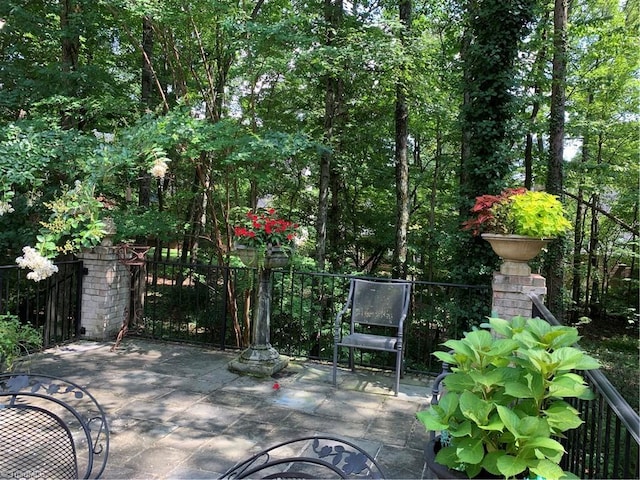 view of patio featuring fence