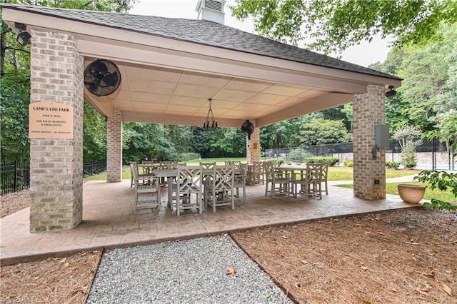 view of patio with outdoor dining space and fence