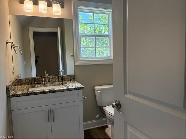 864 Midway School Rd, Winston-Salem, NC 27107 - half bathroom featuring baseboards, vanity, toilet, and wood finished floors