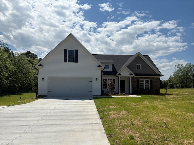 864 Midway School Rd, Winston-Salem, NC 27107 - view of front of house with concrete driveway, a front yard, and an attached garage