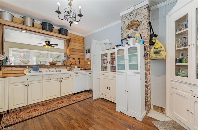 kitchen with sink, ceiling fan with notable chandelier, white dishwasher, hardwood / wood-style floors, and ornamental molding