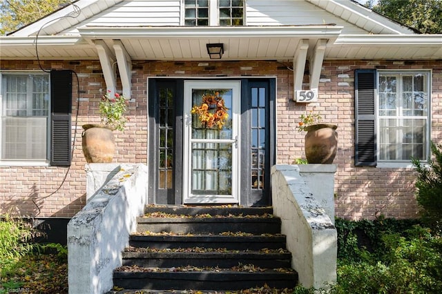 entrance to property featuring covered porch