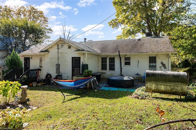 back of house with a yard