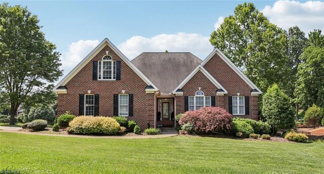 3741 Canter Dr, Trinity, NC 27370 - traditional-style house featuring a front lawn and brick siding
