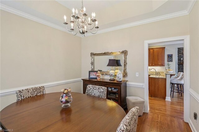 3741 Canter Dr, Trinity, NC 27370 - dining area featuring a chandelier, ornamental molding, and wood finished floors