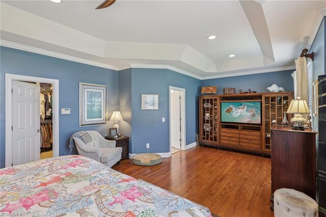 3741 Canter Dr, Trinity, NC 27370 - bedroom featuring a tray ceiling, wood finished floors, a spacious closet, crown molding, and recessed lighting