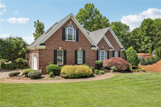 3741 Canter Dr, Trinity, NC 27370 - view of front of house with brick siding and a front yard