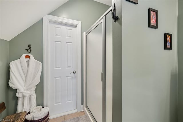 3741 Canter Dr, Trinity, NC 27370 - full bathroom with a stall shower, tile patterned flooring, and lofted ceiling