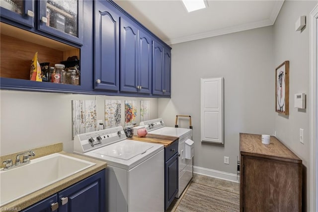 3741 Canter Dr, Trinity, NC 27370 - laundry room featuring washing machine and dryer, cabinet space, crown molding, and tile patterned floors