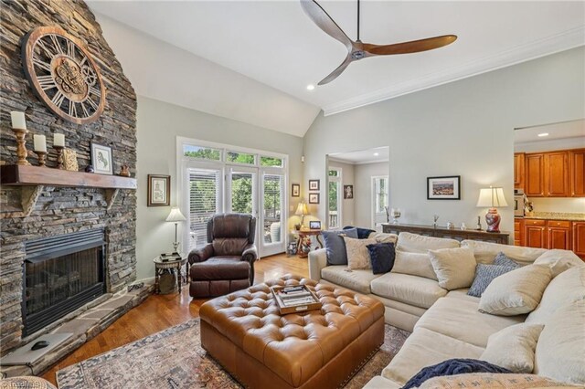 3741 Canter Dr, Trinity, NC 27370 - living area with lofted ceiling, a ceiling fan, light wood finished floors, a fireplace, and recessed lighting