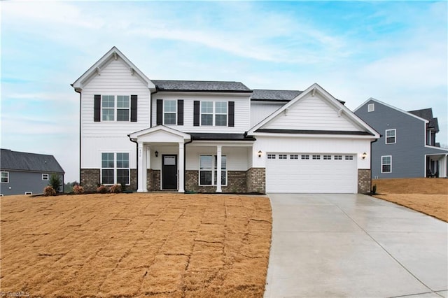 view of front facade featuring driveway, brick siding, a porch, and an attached garage