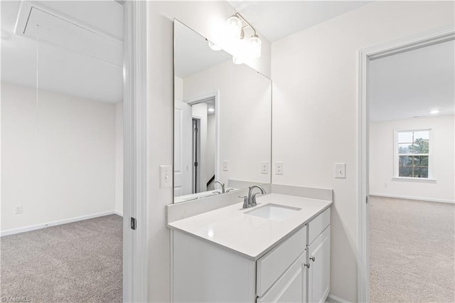 bathroom with baseboards and vanity