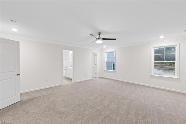 unfurnished room featuring light carpet, recessed lighting, crown molding, baseboards, and ceiling fan