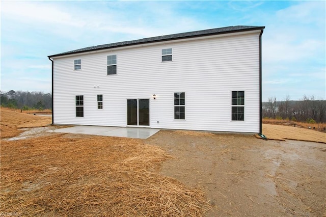 back of property with a patio