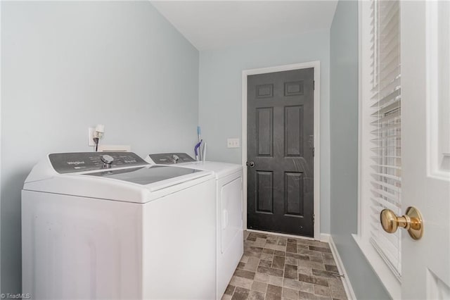 washroom featuring washer and clothes dryer