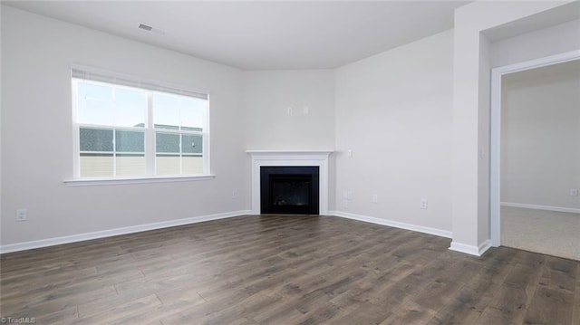 280 Lisa Ln, Winston-Salem, NC 27107 - unfurnished living room with dark wood-style floors, a fireplace, and baseboards