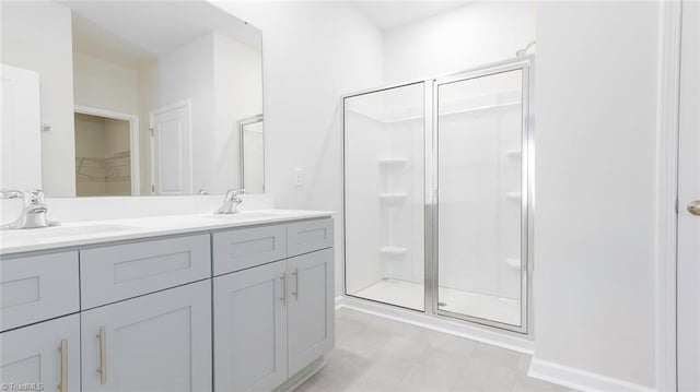 280 Lisa Ln, Winston-Salem, NC 27107 - full bath with a shower stall, double vanity, a walk in closet, and tile patterned floors