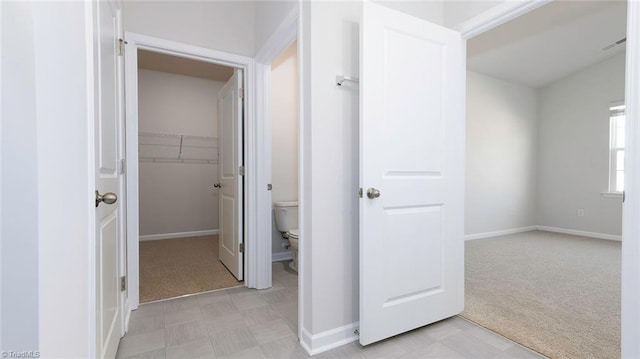 280 Lisa Ln, Winston-Salem, NC 27107 - corridor featuring light carpet, baseboards, and light floors