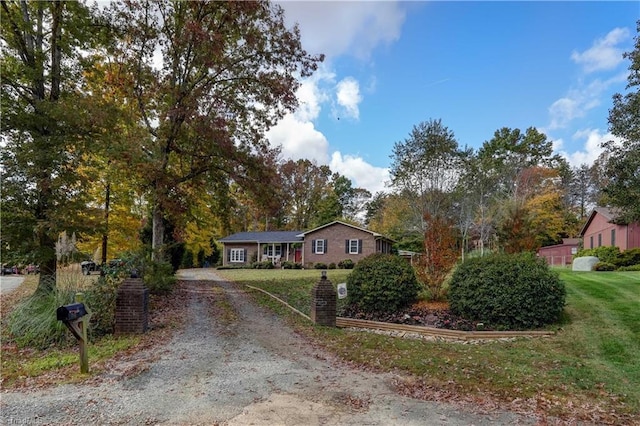 single story home featuring a front yard