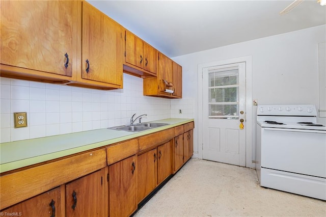800 Essex Rd, Winston-Salem, NC 27105 - kitchen with white electric range oven, a sink, decorative backsplash, light countertops, and brown cabinetry