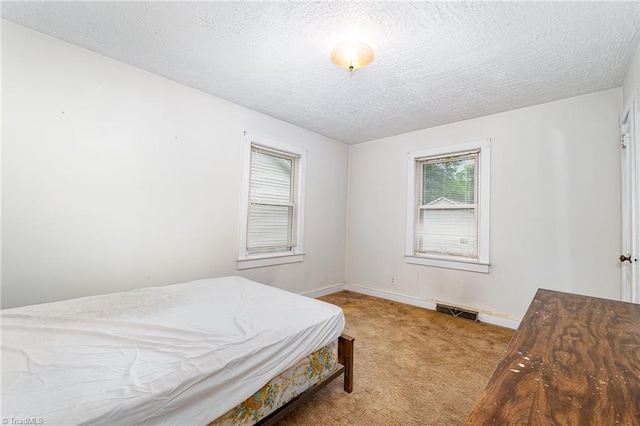 800 Essex Rd, Winston-Salem, NC 27105 - carpeted bedroom with a textured ceiling and baseboards