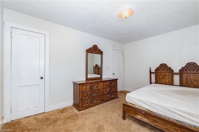 800 Essex Rd, Winston-Salem, NC 27105 - bedroom with light colored carpet, baseboards, and a textured ceiling