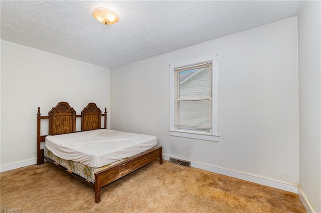 800 Essex Rd, Winston-Salem, NC 27105 - carpeted bedroom featuring baseboards and a textured ceiling