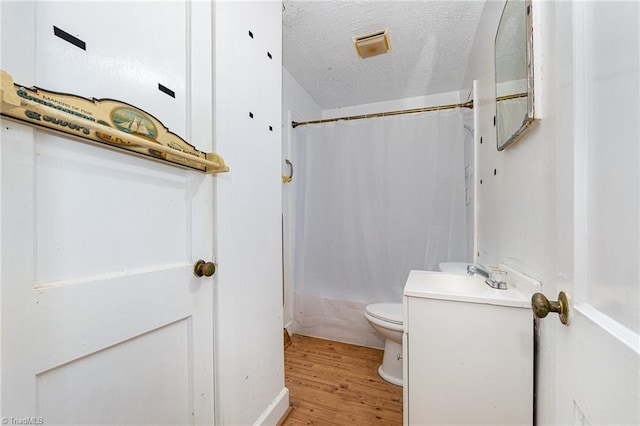 800 Essex Rd, Winston-Salem, NC 27105 - full bath featuring wood finished floors, toilet, a textured ceiling, shower / tub combo, and vanity