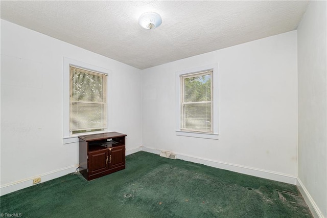 800 Essex Rd, Winston-Salem, NC 27105 - unfurnished room featuring dark carpet, a textured ceiling, and baseboards