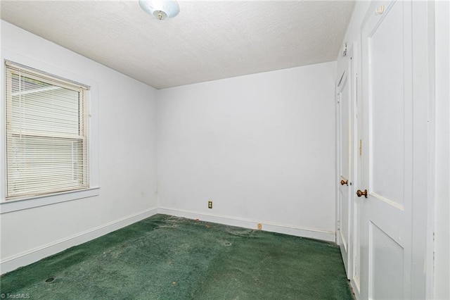 800 Essex Rd, Winston-Salem, NC 27105 - empty room featuring carpet flooring, baseboards, and a textured ceiling