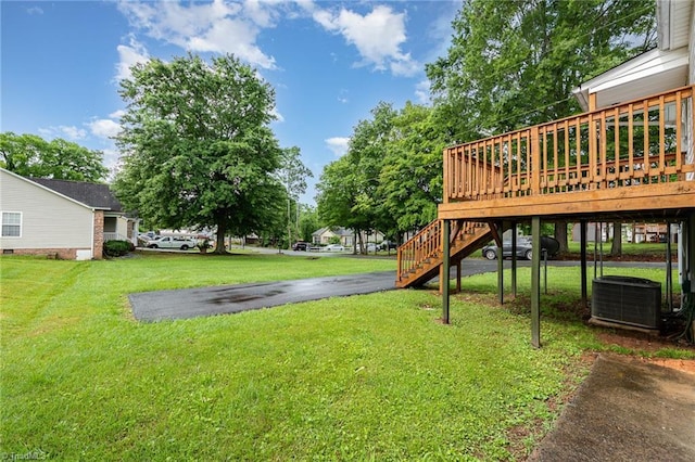 800 Essex Rd, Winston-Salem, NC 27105 - view of grassy yard featuring central AC unit, a wooden deck, and stairway