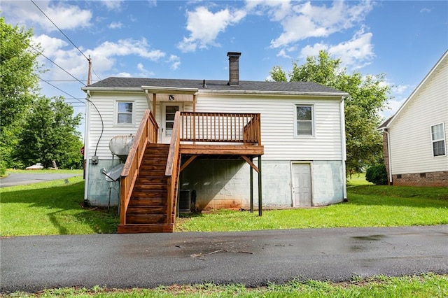 800 Essex Rd, Winston-Salem, NC 27105 - back of house with a chimney, a wooden deck, stairs, and a yard
