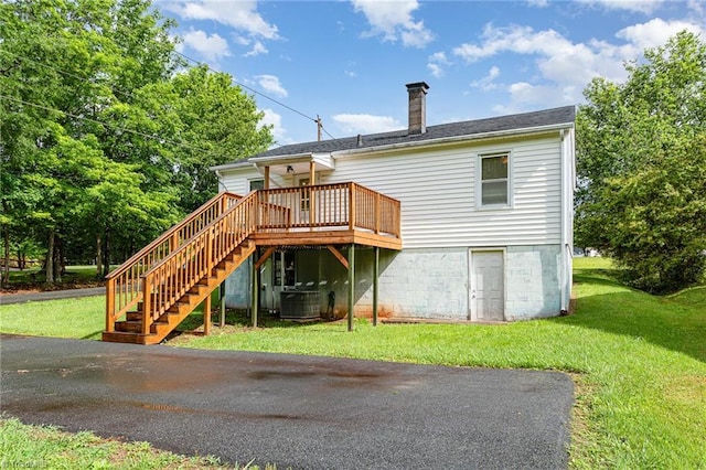 800 Essex Rd, Winston-Salem, NC 27105 - back of property featuring a chimney, a yard, a deck, stairs, and central AC unit