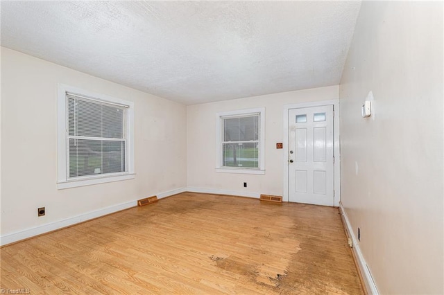 800 Essex Rd, Winston-Salem, NC 27105 - entryway featuring light wood-style flooring, a textured ceiling, and baseboards