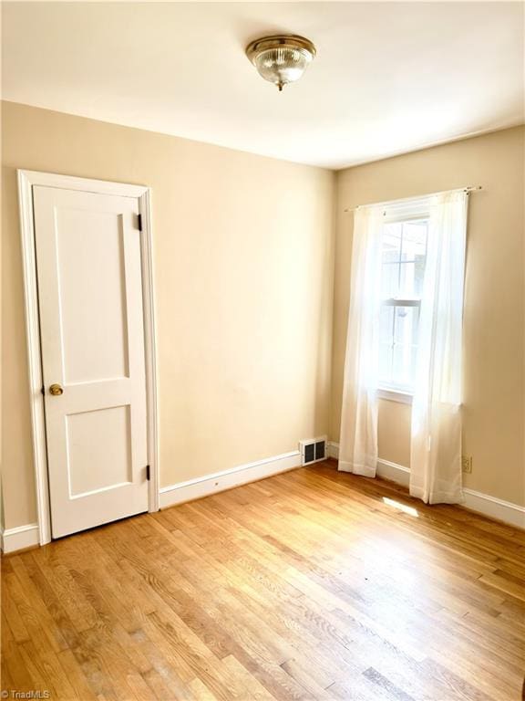 211 Hermitage Rd, Greensboro, NC 27403 - spare room with light wood-style floors and baseboards