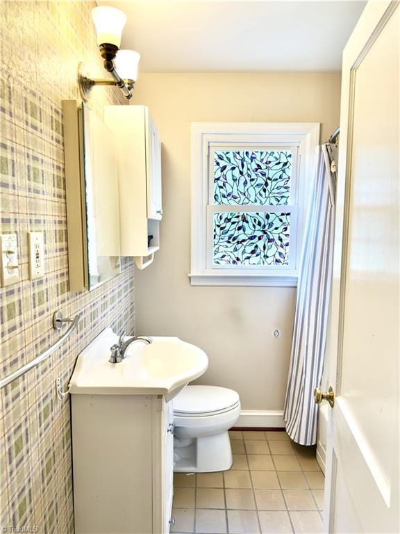211 Hermitage Rd, Greensboro, NC 27403 - bathroom featuring tile patterned flooring, vanity, toilet, and backsplash