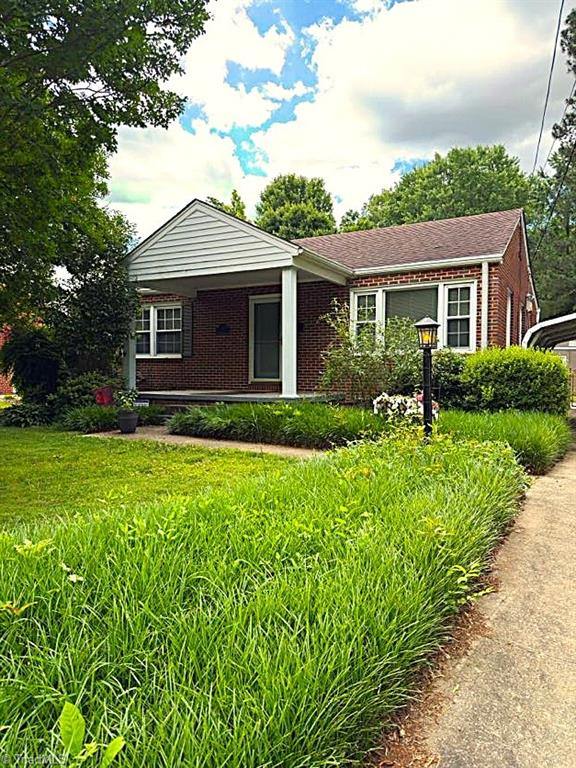 211 Hermitage Rd, Greensboro, NC 27403 - view of front facade featuring brick siding
