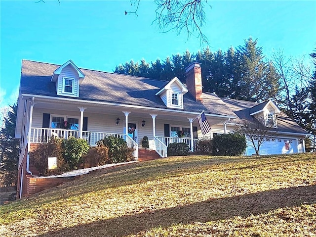 cape cod house featuring a porch, a garage, a front yard, and a chimney