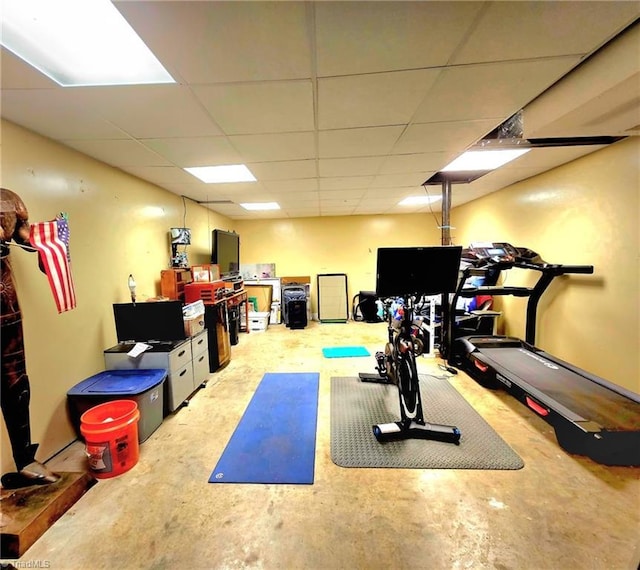 exercise area featuring a drop ceiling